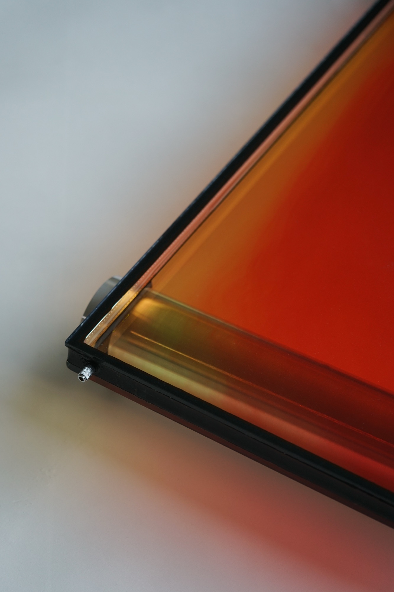 wave chamber — liquid-filled glass pane with shifting color gradients